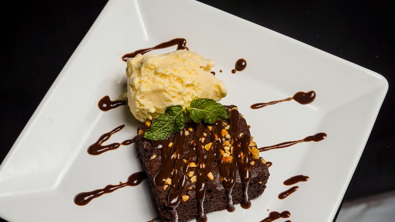 Warm chocolate brownie dessert with ice cream